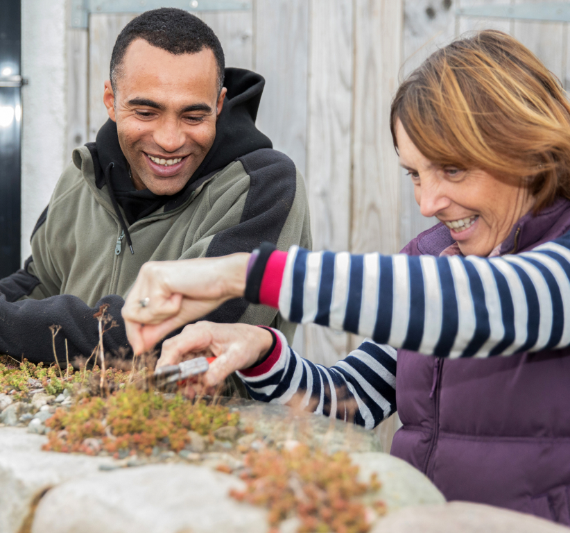 A man and a woman gardening