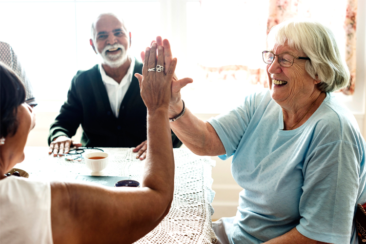 Happy Older Group with High Five