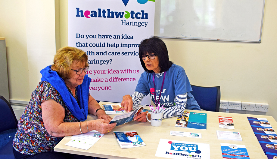 Two volunteers running a Healthwatch Haringey Stall